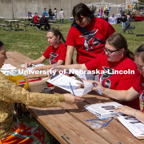 UNITE members register Kaira Wolfe, who served as the head woman dancer during the powwow. 2022 UNITE powwow to honor graduates (K through college). Held April 23 on the greenspace along 17th Street, immediately west of the Willa Cather Dining Center. This was UNITE’s first powwow in three years. The MC was Craig Cleveland Jr. Arena director was Mike Wolfe Sr. Host Northern Drum was Standing Horse. Host Southern Drum was Omaha White Tail. Head Woman Dancer was Kaira Wolfe. Head Man Dancer was Scott Aldrich. Special contest was a Potato Dance. April 23, 2023. Photo by Troy Fedderson / University Communication.